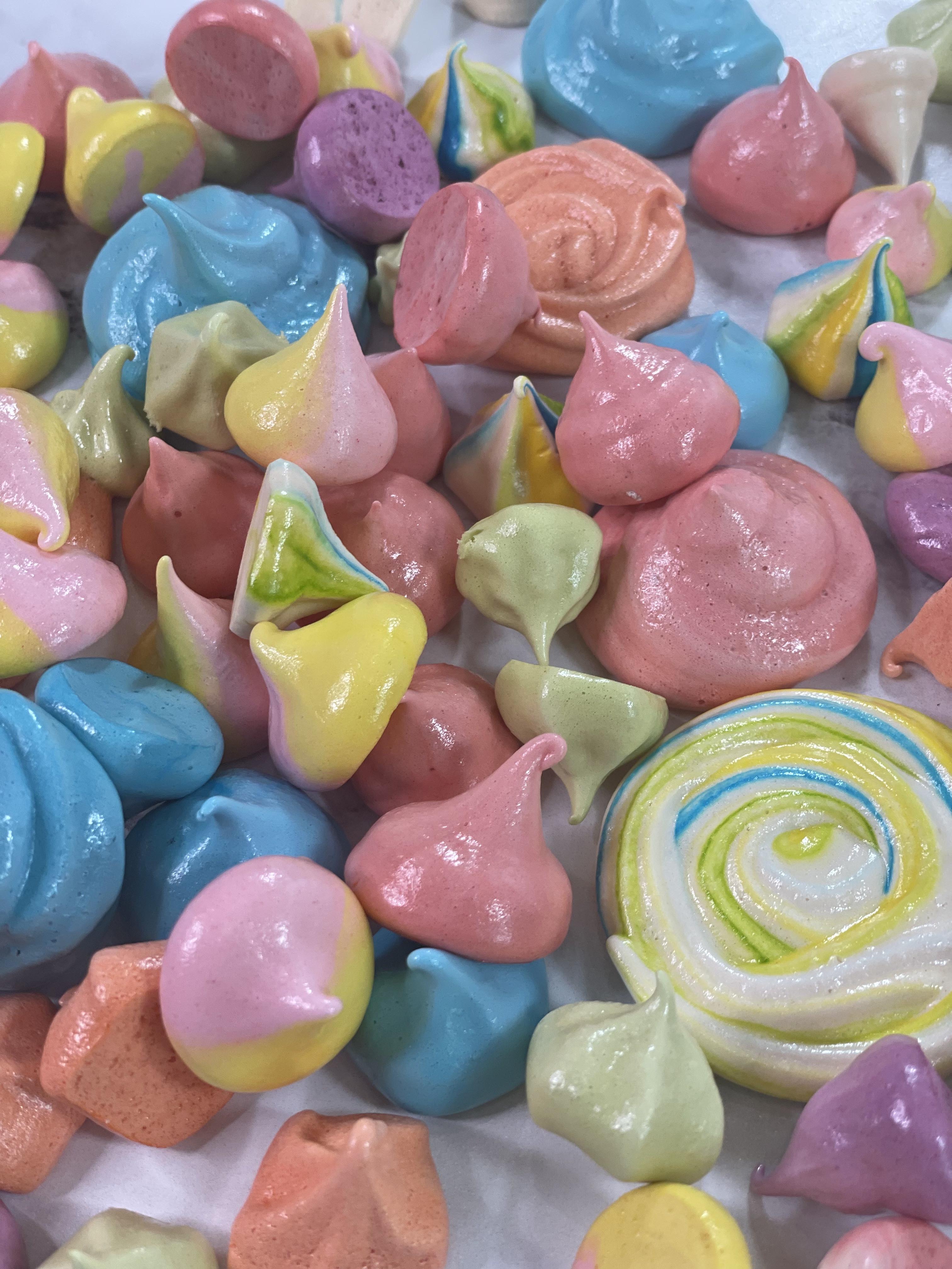easy to follow french meringue recipe whips egg whites add sugar and then pipe into shapes like hershey kisses and rose swirls 